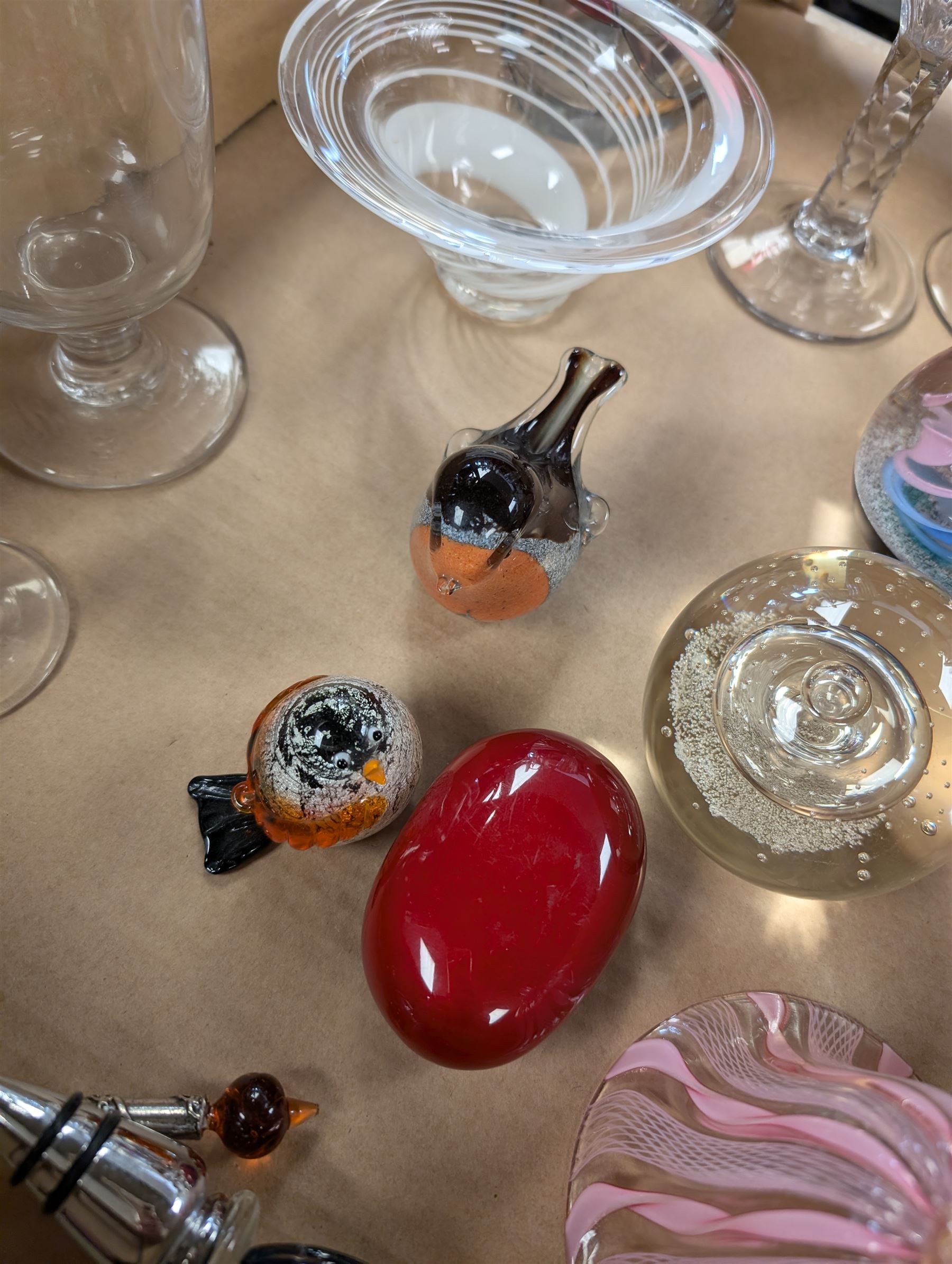 Collection of glassware, including two Caithness paperweights, Langham robin paperweight, Murano bell, etc
