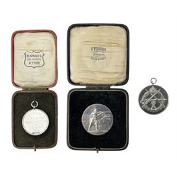Hallmarked silver medallion inscribed 'A Coy 2nd Bn. The Border Regt.Cross Country Running 1st L/C Amy 1914'; cased; another sterling silver medallion inscribed 'S.A.S. Champion At Arms1928 QM51 R.H. Amy'; and another similar by Phillips Aldershot bearing The Buffs Regimental Crest on one side and a soldier shooting a rifle on the reverse; cased (3)