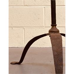 Brass mounted wrought iron two branch candle stand on a tripod base, possibly American. H162cm.  - COLLECTION BY APPOINTMENT FROM: The White House, Thirsk Road, Easingwold, York, YO61 3NF - CALL 01723 507111 TO ARRANGE