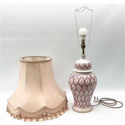 Portuguese ceramic lamp of baluster form, with pink decoration and accompanied with pink lampshade with tassel decoration, H59cm, without lampshade. 