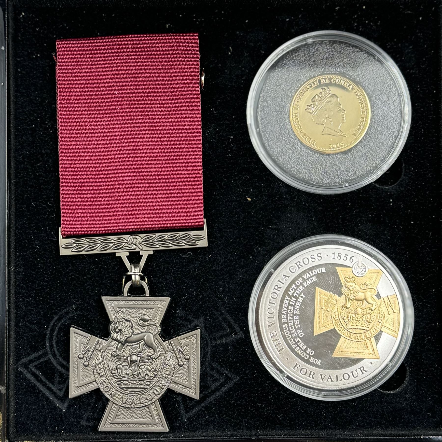 'The Victoria Cross Gold and Silver Commemorative Set' comprising Queen Elizabeth II Tristan Da Cunha 2016 9ct gold double crown, 2016 sterling silver one crown and a replica VC medal, cased with certificate 