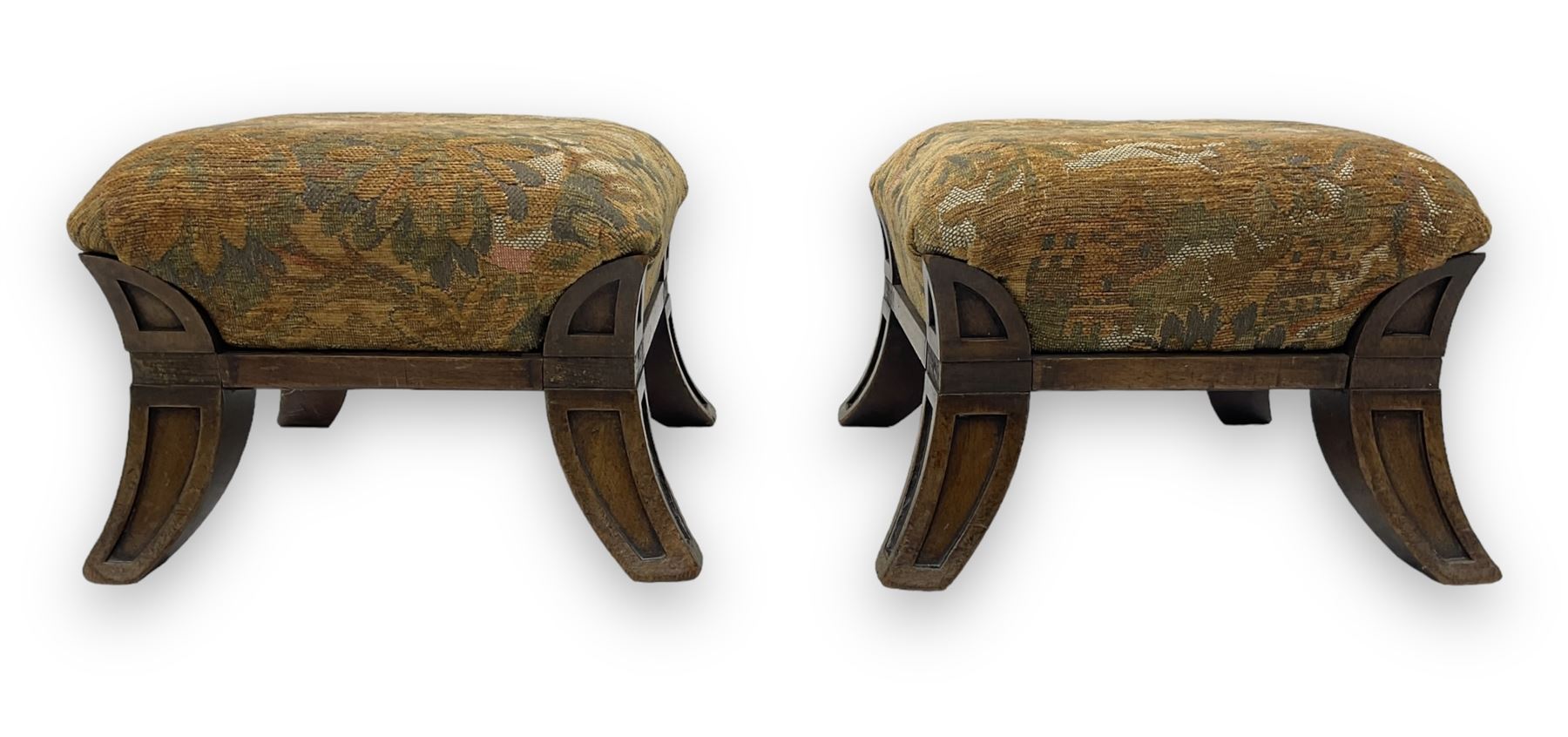 Pair of early 20th century miniature footstools, square seat covered in gold and orange floral patterned tapestry fabric, on carved wooden frame with splayed supports 