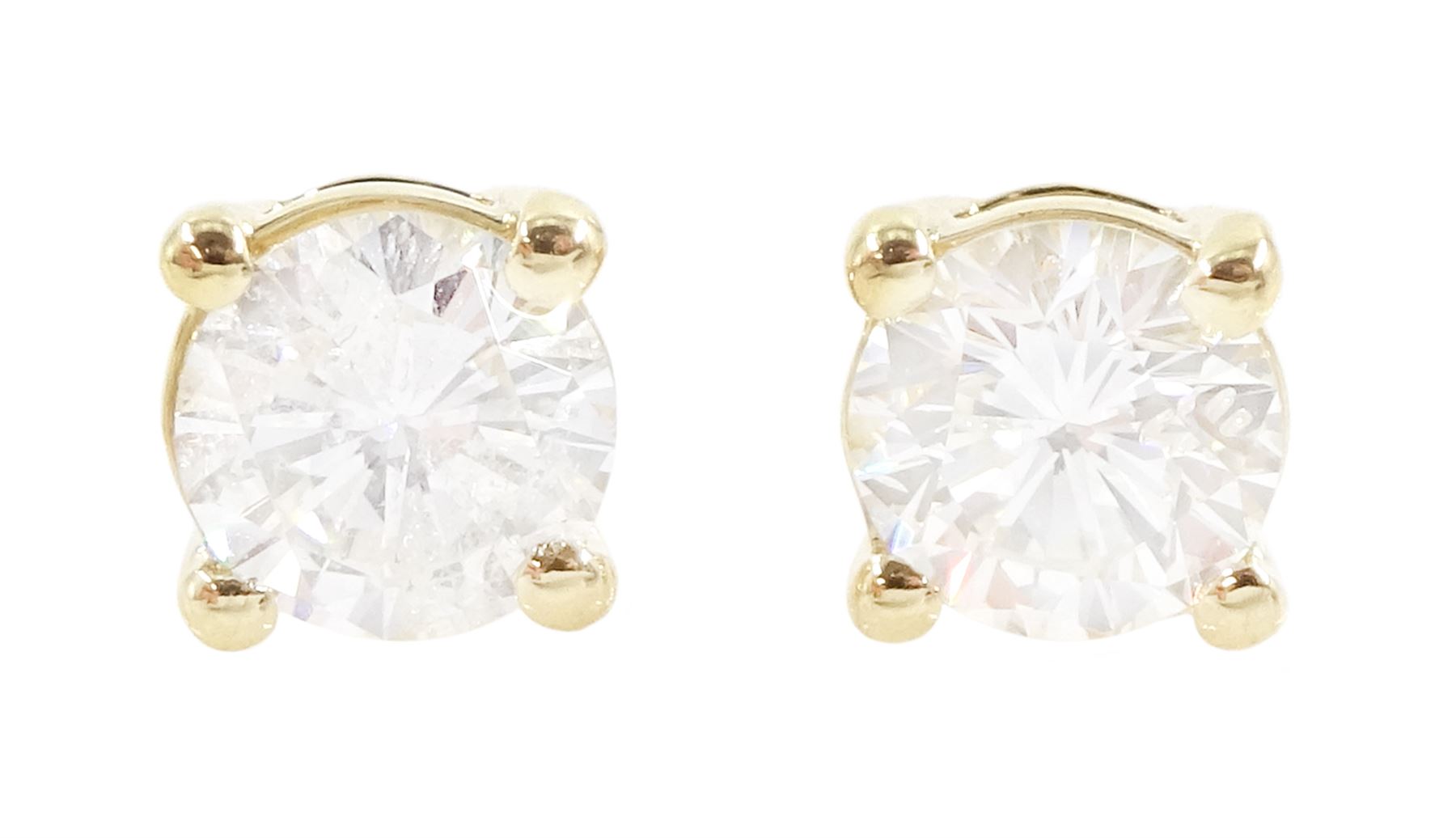 Pair of 18ct gold round brilliant cut diamond stud earrings, stamped, total diamond weight approx 0.80 carat