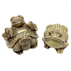 Two netsuke, comprising an example modelled with three frogs upon the shell of a tortoise together with a frog with scaled body, largest L8cm