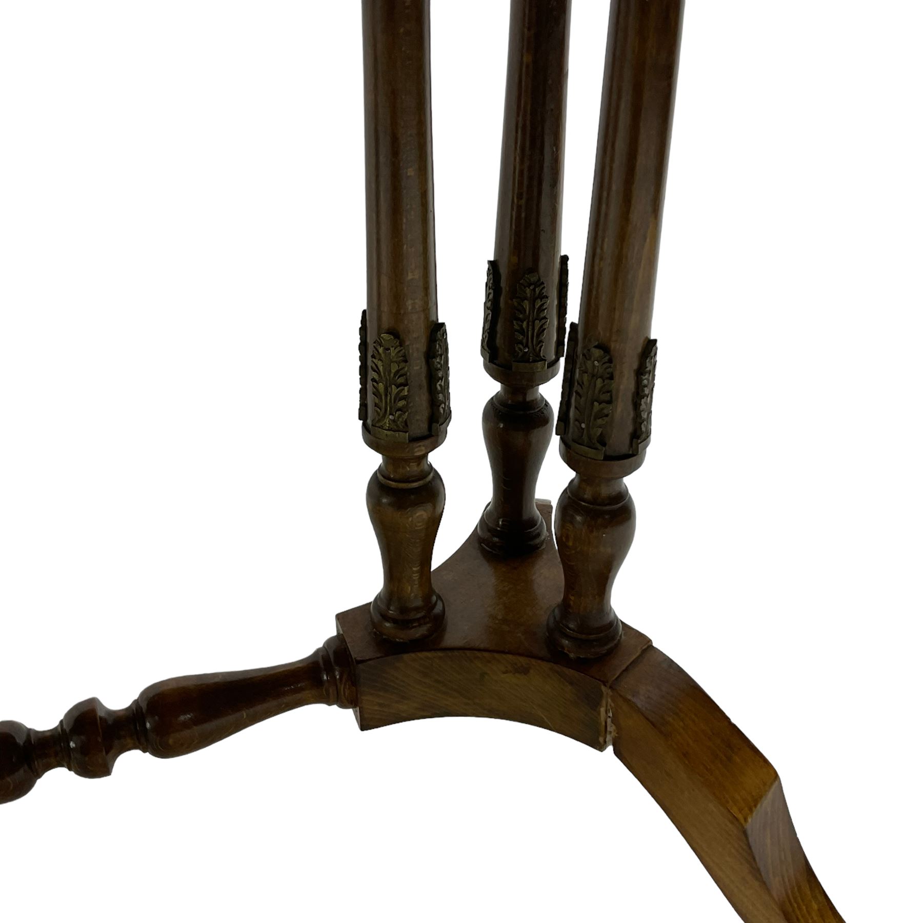 Early 20th century walnut coffee table, oval dished top with sunburst matched veneer, raised on twin cluster columns united by turned stretcher base on splayed supports