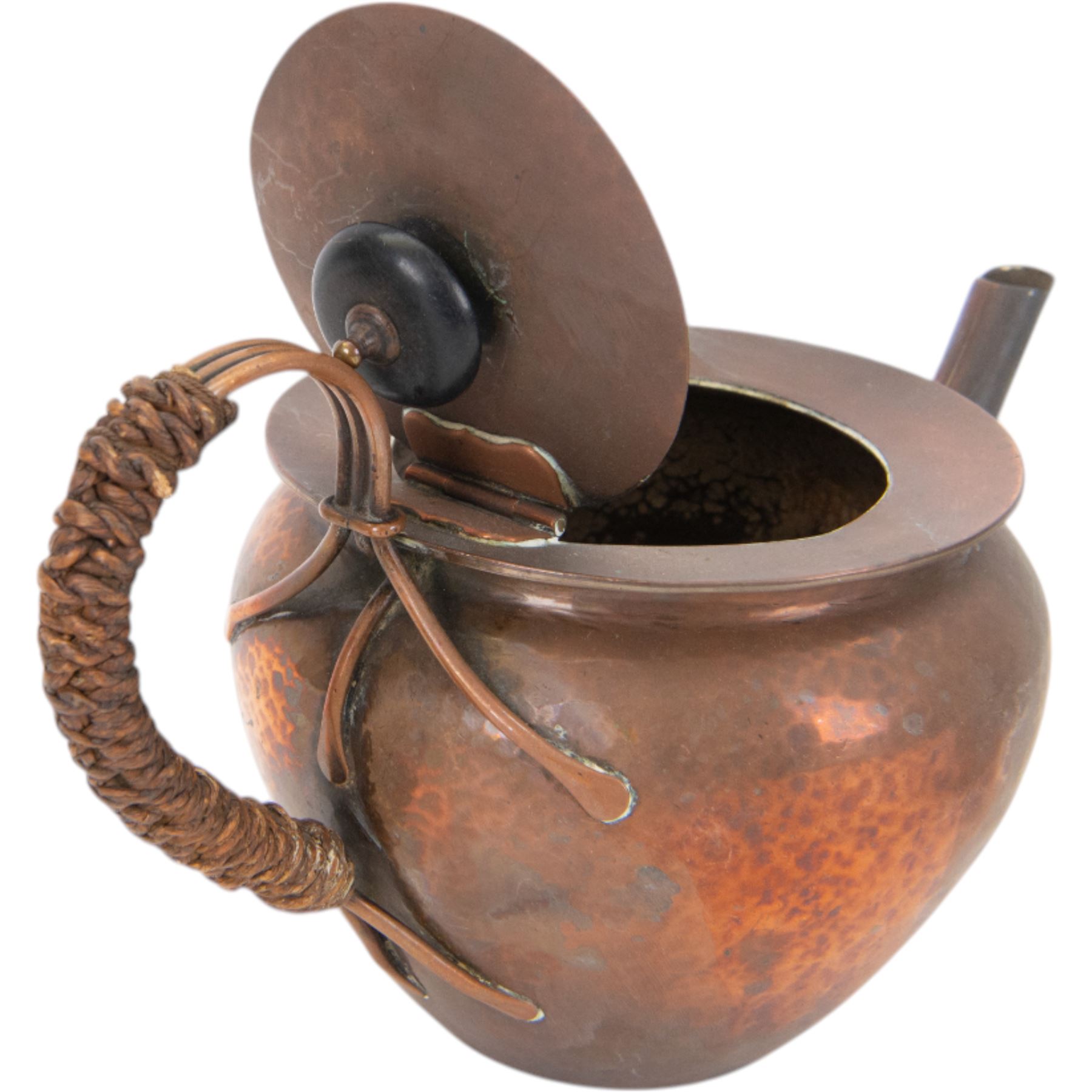 Keswick School of Industrial Arts: Arts & Crafts copper teapot, of stylised squat form with cane bound reed handle and ebony finial, together with a lidded jug, of bellied form with cane bound handle and Bakelite type thumbpiece and a cream jug of squat form with stylised loop handle, all stamped KSIA beneath, tallest H14cm
