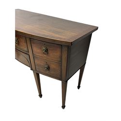 George III mahogany bow-fronted sideboard, mahogany banded top over three drawers and cupboard, fitted with lion mask and hoop handles, on square tapering supports with spade feet