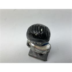 Robinson Jam plaster Golly band, including drummer and singer, H7.5cm

Originally handmade by mothers in Africa for their children from old fabric and cloth, the golly doll was adopted as the mascot and trademark for the Robertson's confectionery brand around 1910 after the company's founder John Robertson visited the US and noticed children playing with them. Robertson's Gollies have been collected by people across the UK and around the world for generations but garnered a contentious image in the 1980s because of links to racism. The trademark was removed from Robertson's branding in 2001.