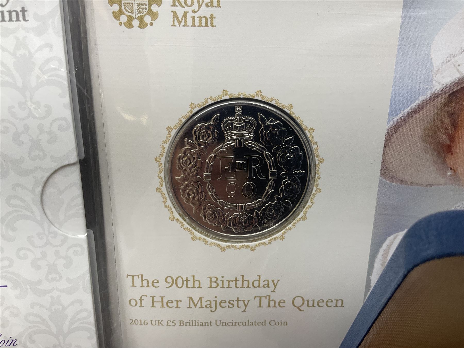 Queen Elizabeth II 1977 silver crown and 1980 silver crown, both cased with certificates, Bailiwick of Guernsey 1978 silver crown cased without certificate, three United Kingdom brilliant uncirculated five pound coins in card folders and twelve other five pound coins