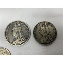 William III silver crown coin illegible date, two Queen Victoria Gothic florins, 1881 halfcrown, 1887 shilling, 1890 double florin, 1890 crown and a George III 1819 crown coin with pin brooch back
