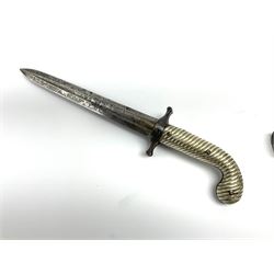 Rare double barrel percussion knife pistol by Dumonthier & Sons (NVN), approx. .38 calibre, with 8.5cm barrels and central 21.5cm spear pointed blade, all with etched damascening, upper quillons serve as hammers for the percussion ignition with single drop down trigger and fluted nickel grips, in nickel mounted leather covered tin scabbard L33.5cm overall