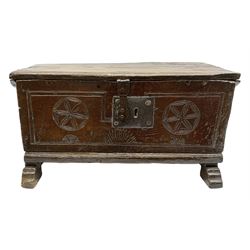 17th/18th century boarded oak plank box, the hinged lid with front mould, the front with iron lock carved with star motifs, upon sledge supports, H28cm W55cm D28cm