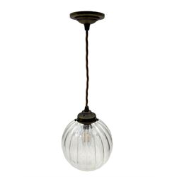 Set of two small and two large pendant lights, each with clear glass spherical shade with moulded swirl pattern, suspended from twisted cords, brass ceiling rose