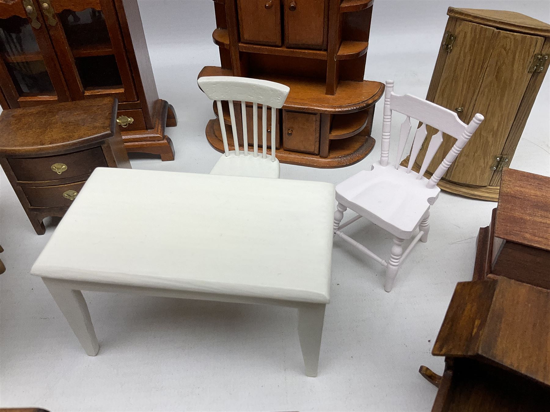 Doll's house wooden furniture - over twenty items including good quality pine Welsh dresser by Tony of Lincoln; tall 'glazed' bookcase; two-tier side cabinet; grand piano; bedside chest, mule chest, Canterbury; cradle; Georgian style hanging corner cupboard; dumb waiter; tables; chairs; rocking chair etc; various scales