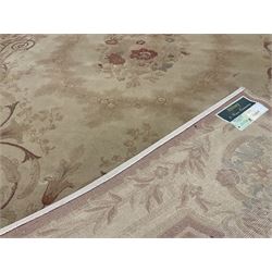 Axminster beige ground rug, central medallion, repeating boarder 