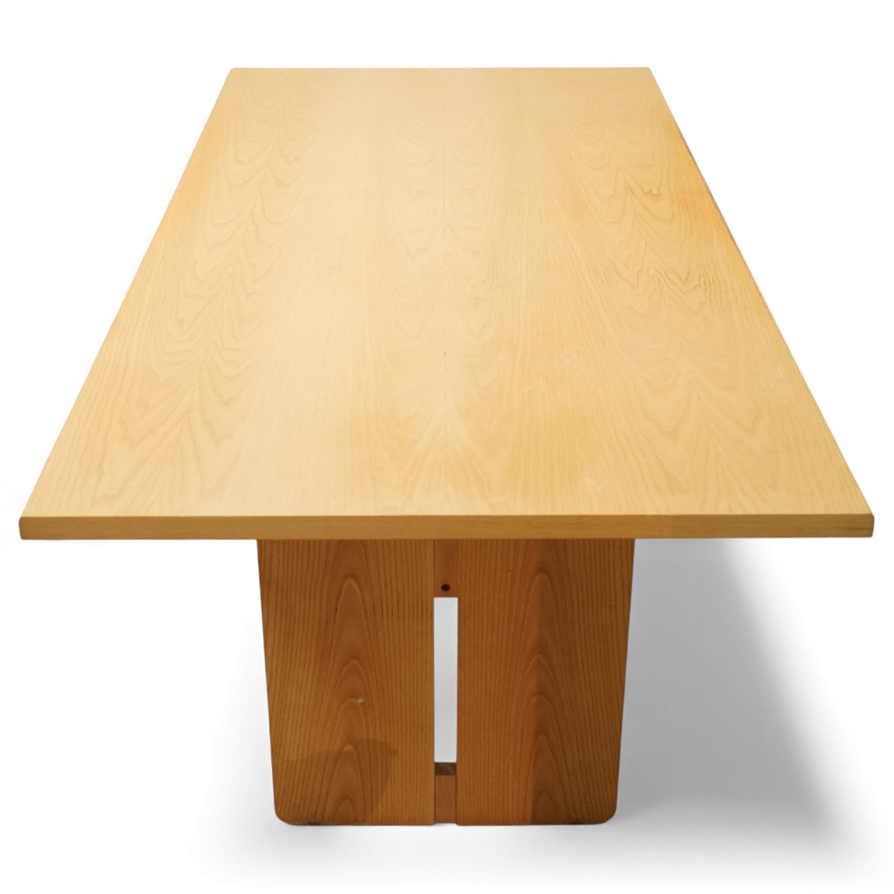 Heals - oak veneered dining table, with rectangular plain-surfaced top on twin slab end supports incorporating central cut-outs