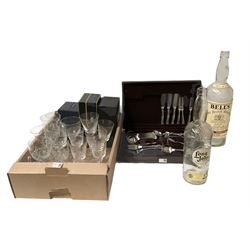 Two large whisky bottles, commemorative glasses and part stainless steel canteen 