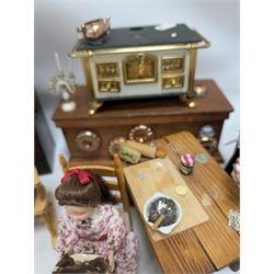 Victorian and later style dolls house kitchen furniture, including countertop, dresser displaying copper pots and blue and white ceramics, baking table, oven, three figures and a collection of food and baking accessories