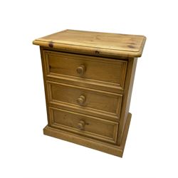 Pair of solid pine three drawer bedside chests