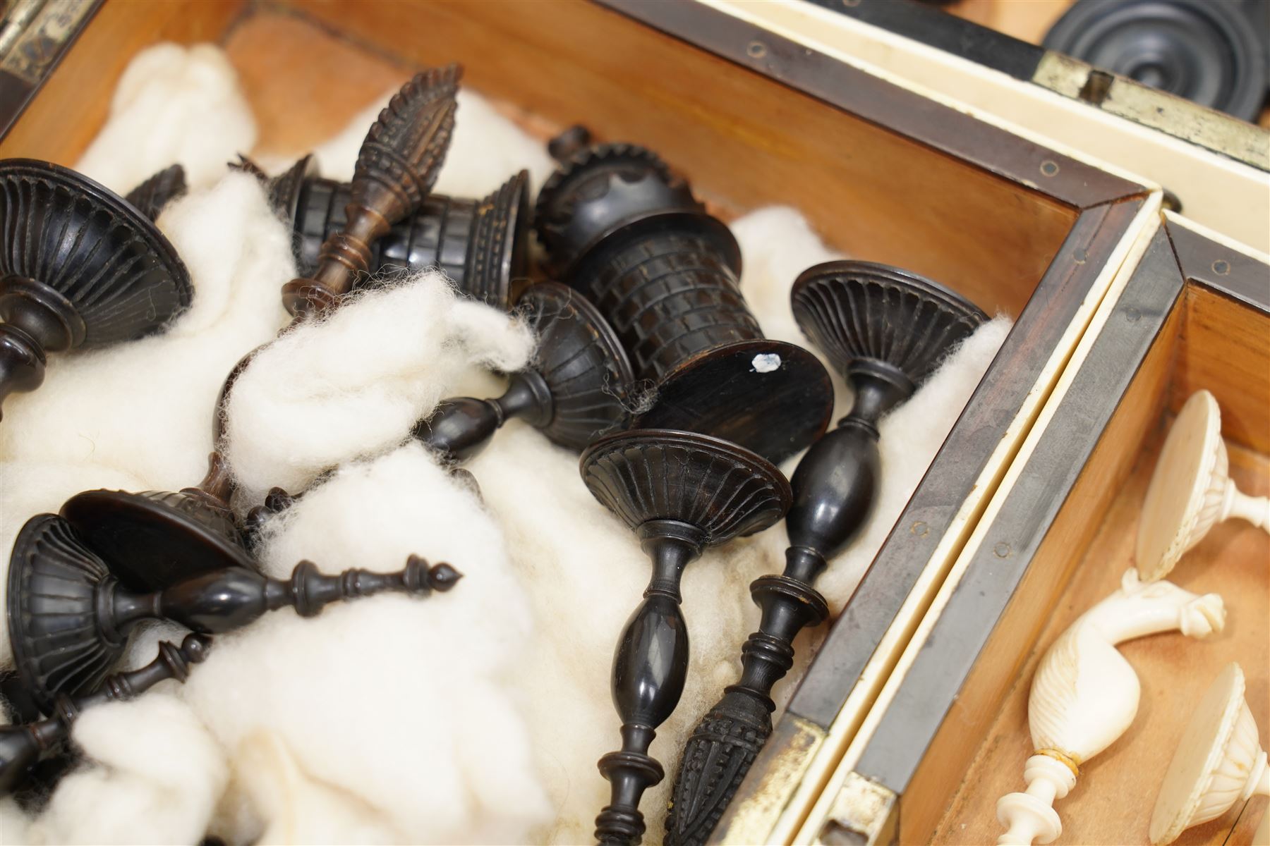 Mid-19th-century Anglo Indian Vizagapatam ivory, sandlewood, and horn veneered backgammon/chess board, circa 1860, rectangular games box the borders engraved with a stylized scrolling leaf decoration and spine engraved History of Persia the interior inlaid for backgammon, with three internal sandalwood boxes with covers, containing 16 ivory pieces and 16 horn pieces, comprising, kings and queens with pierced crowns on baluster carved shafts; bishops with carved mitres; knights represented by horses’ heads; and rooks as towers with imbricated decoration.

This item has been registered for sale under section 10 of the APHA Ivory Act, submission reference G68PNYA5 

