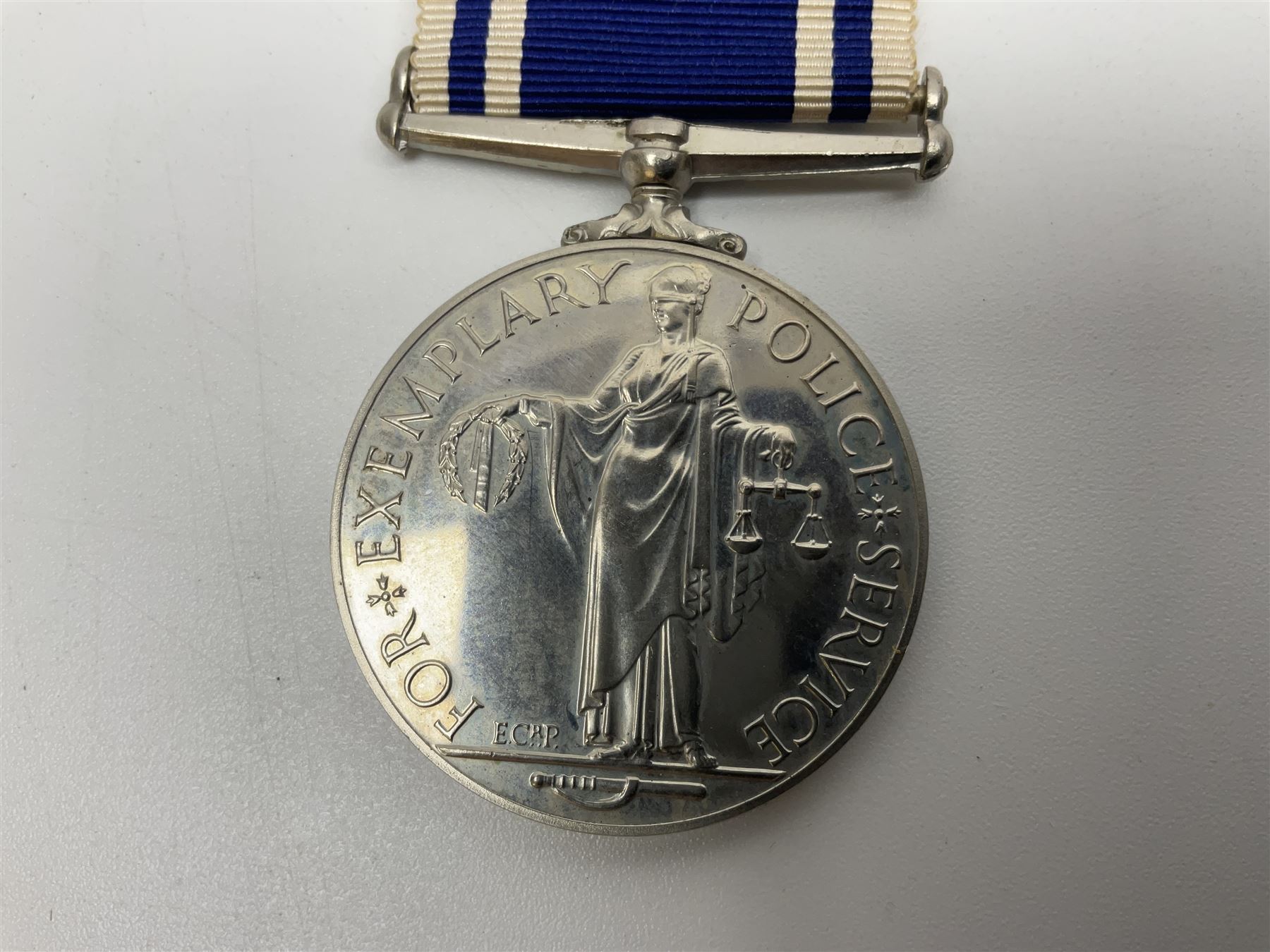 Collection of WW2 and police medals c.1933-1955, awarded to Eric Drinkwater comprising 1939-45 War Medal, Defence Medal, 1939-45 Star and Burma Star, on wearing bar; 1918-62 General Service Medal with Cyprus clasp to P.S. E.G. Drinkwater; boxed; Police Long Service and Good Conduct Medal to Const. Eric C. Drinkwater; cased; Royal Life Saving Society bronze medal to E.C. Drinkwater July 1933; boxed; and George V 1937 coronation medallion; boxed.