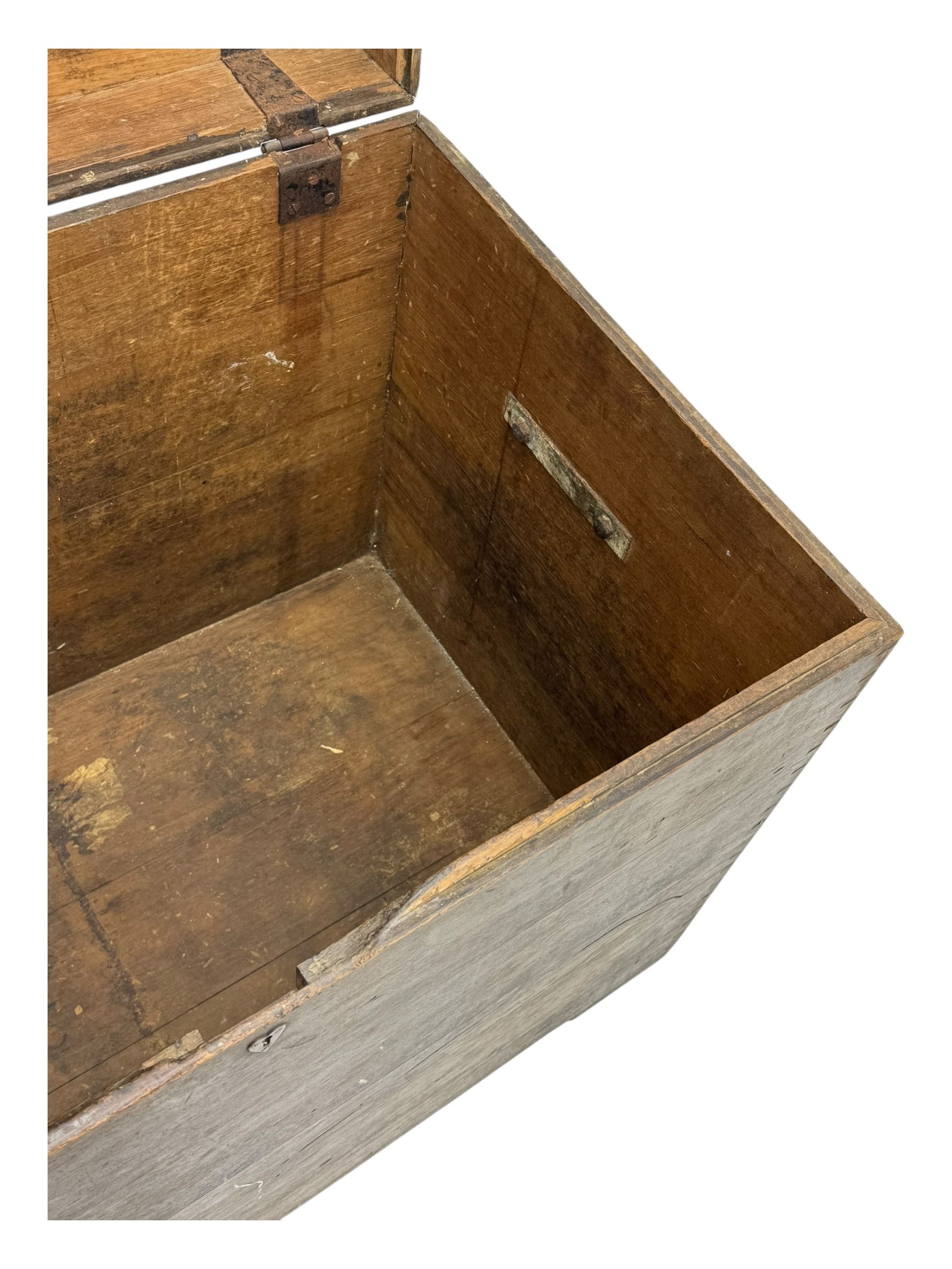 Early 20th century oak blanket chest, of rectangular form with iron strap hinges and surface-mounted drop handles, the interior fitted with iron lid stays, on bracket feet