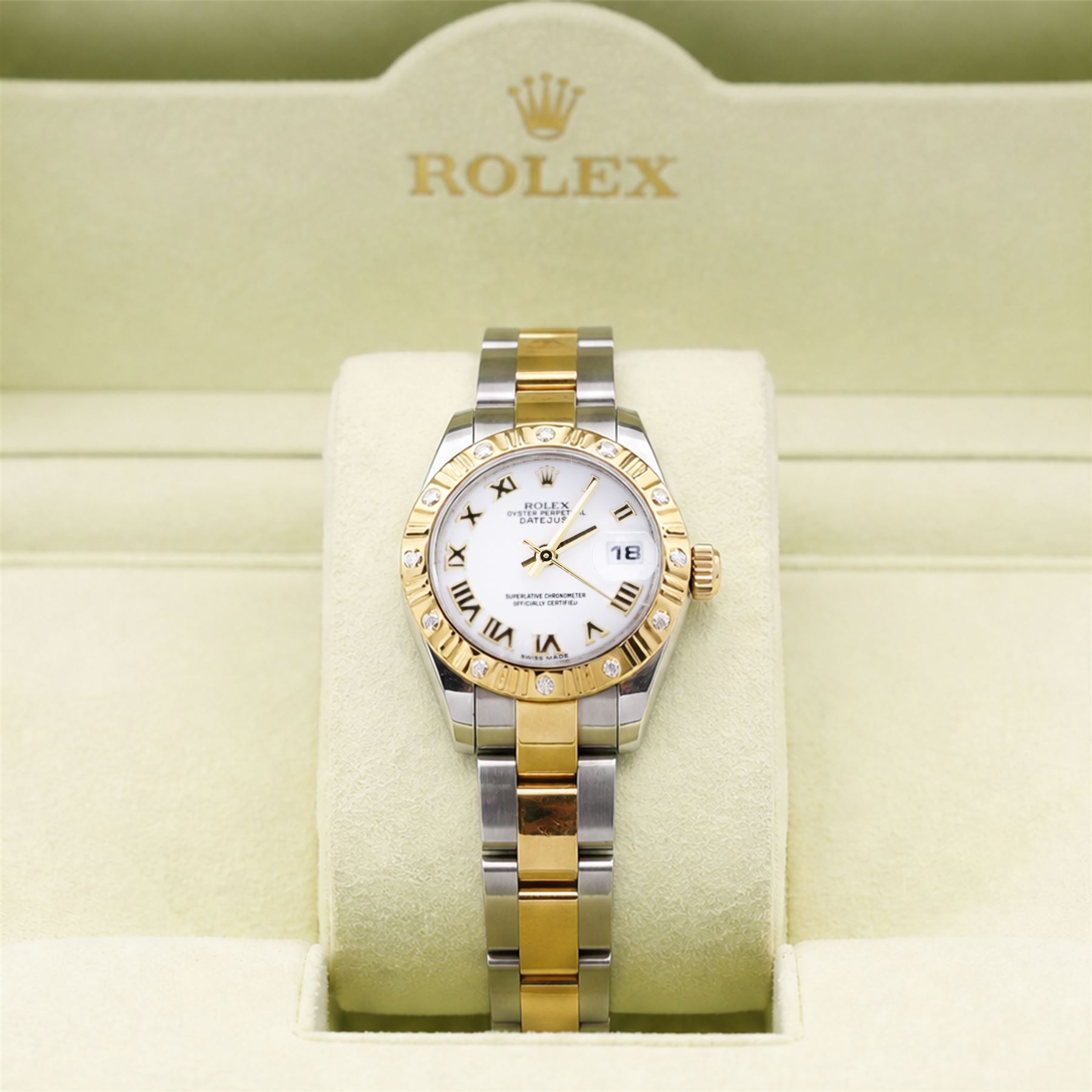 Rolex Oyster Perpetual Datejust ladies stainless steel and gold automatic wristwatch, circa 2009, Ref. 179313, serial No. V739209, white dial with Roman numeral hour markers and 18ct gold diamond set bezel, on gold and stainless steel and gold Oyster bracelet, with fold-over clasp, boxed with papers