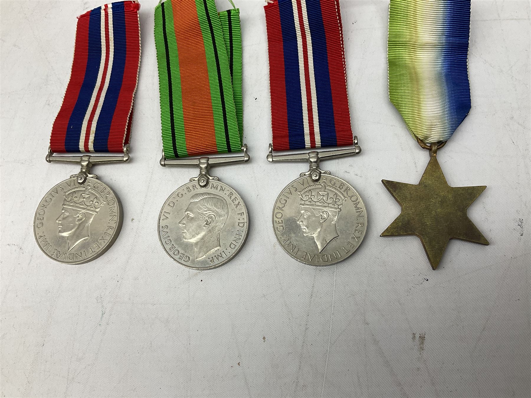 Eight WW2 medals comprising two War Medals 1939-1945, two Defence Medals, Atlantic Star, Italy Star, Pacific Star and 1939-1945 Star; all with ribbons (8) 
