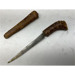 Near pair of African Moroccan Berber tribal Shula daggers each with engraved 39cm curving fullered steel blade, carved and inlaid horn grip and leather covered scabbard L57cm overall; kindjal style dagger with brass covered and jewelled grip and scabbard; another Eastern dagger with leather covered grip and scabbard; and a large Eastern knife with animal hide scabbard (5)