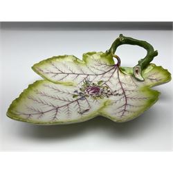 Chelsea leaf shaped dish, circa 1756, with a naturalistically modelled green stalk handle and painted with a central rose floral spray and sprig upon puce veins and shaded green rim, with red anchor mark beneath, W20cm