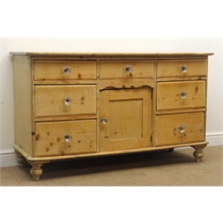  Victorian stripped pine dresser base, seven drawers, single cupboard, turned supports, W138cm, H81cm, D52cm  