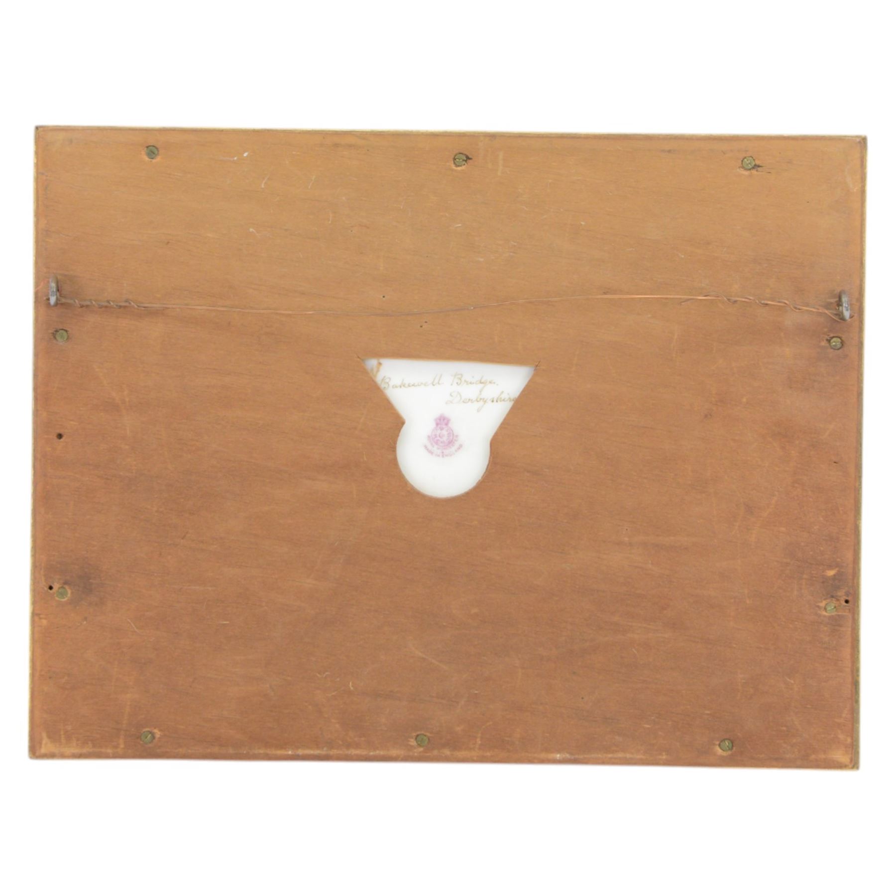 Pair of turn of the century Royal Worcester oval porcelain plaques painted by John Stinton, the first example depicting highland cattle watering against misty mountains, titled 'Loch Lomond' verso, the second depicting cows watering before a bridge with church in the distance, titled 'Bakewell Bridge Derbyshire', each signed J Stinton, each with puce printed mark verso, and date codes for 1899 and 1900, each contained within gilt frame with mount, plaques approximately 14.5cm x 23cm, overall 29.5cm x 38cm