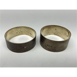 Four silver napkin rings, including pair of Art Deco examples, all hallmarked 