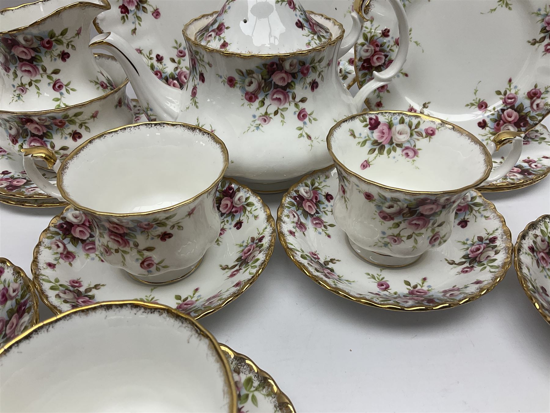 Royal Albert Cottage Garden pattern tea service for six people, comprising teapot, milk jug, sugar bowl, teacups and saucers, side plates and cake plate, all with printed mark beneath