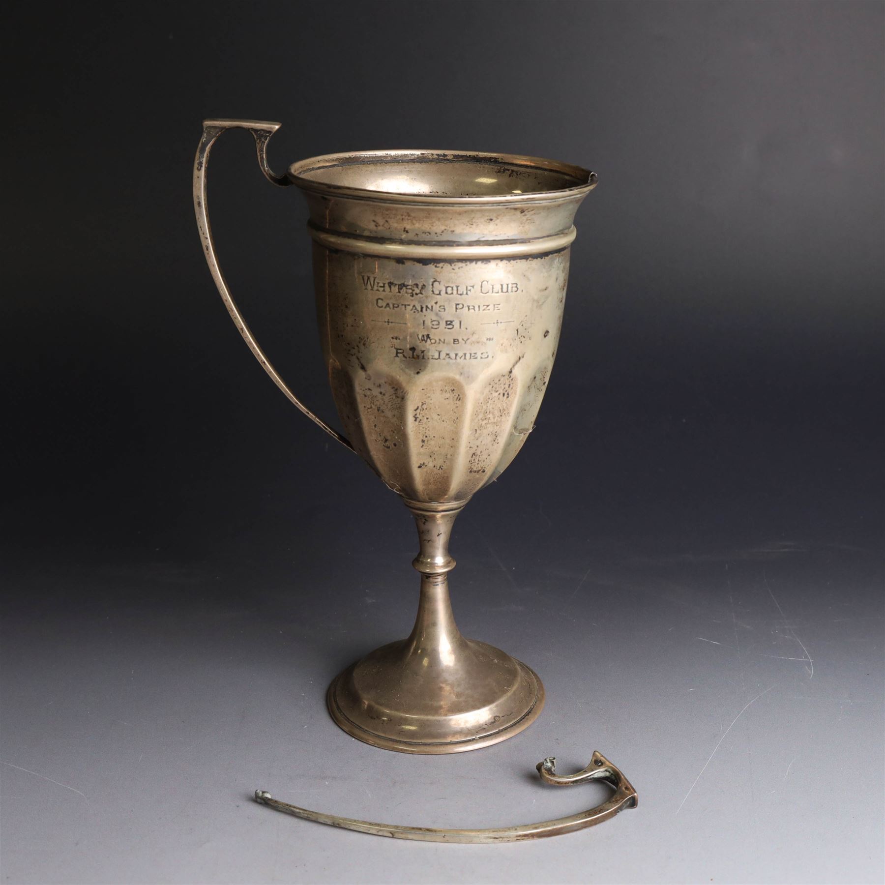 1930s silver trophy cup, of typical part fluted form with presentation engraving to body, with twin handles, one broken loose, hallmarked 	Charles Boyton & Son Ltd, London 1931, H21cm
