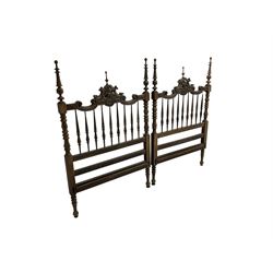 Pair Spanish stained beech single 3' bedsteads, spindle turned backs and carved with scrolling floral decoration 