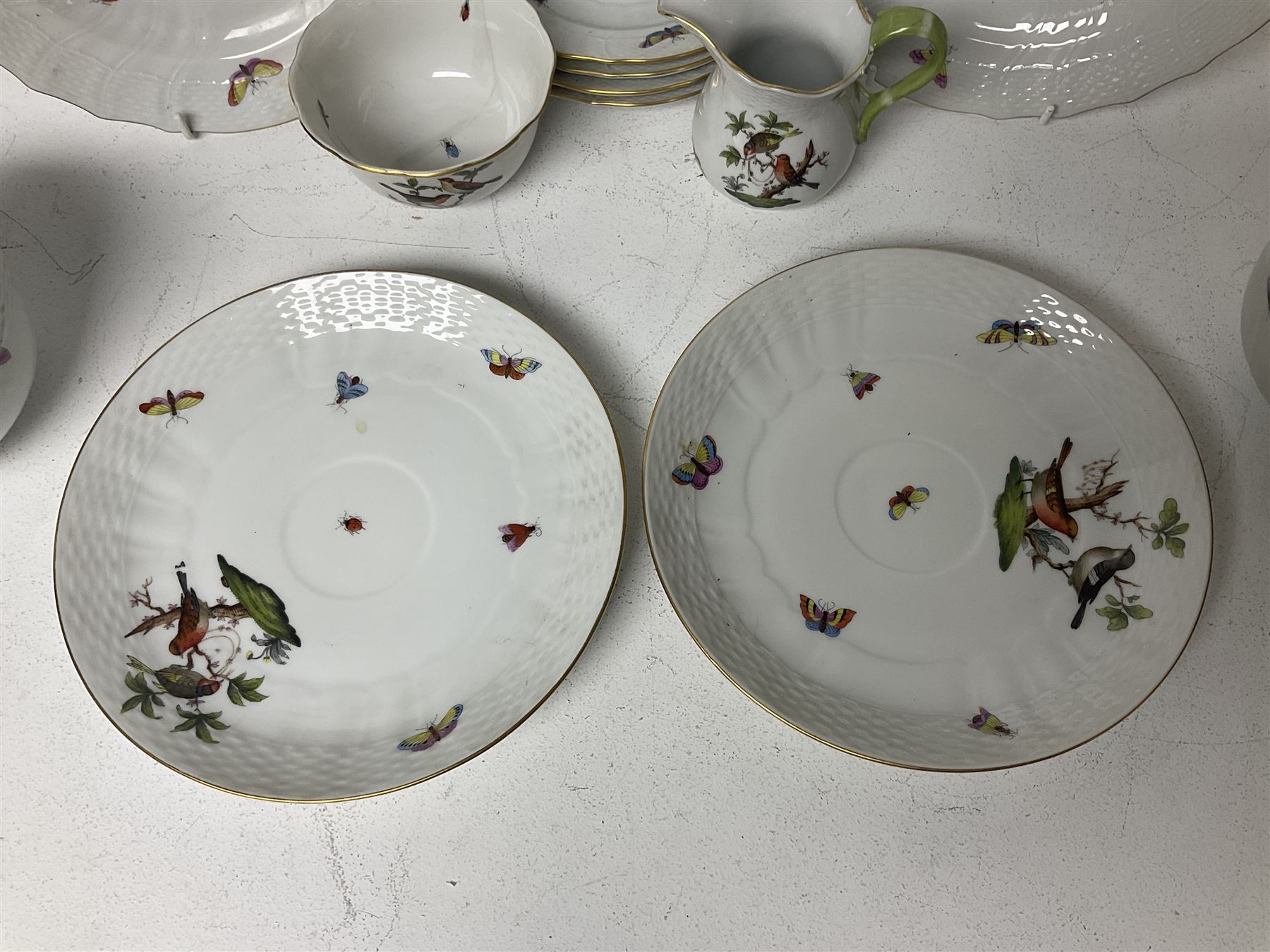 Herend of Hungary Rothschild bird pattern, part tea service, comprising two large teacups and saucers, two teacups and three saucers, milk jug, sugar bowl, five dessert plates and two side plates (18)