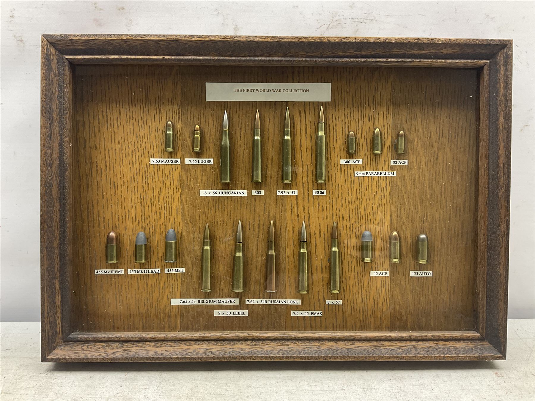 SECTION 1 FIRE-ARMS CERTIFICATE REQUIRED - Two cased specimen displays of annotated ammunition/cartridges - one entitled 'First World War Collection' containing twenty items including 7.63 Mauser, 7.65 Luger, .303, 7.62 x 54R Russian long, 455 Mk.II lead, 455 Auto etc; the other with sixteen items/clips including Musket cartridge, .577 Snider-Enfield, .577/45 Martini Henry, .303 Enfield Magazine, 7.62 Charger Clip, Specialised .303 rounds etc; largest case 41 x 76cm (2)