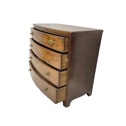 Regency mahogany bow front chest, the top with ebony and satinwood stringing, fitted with four cockbeaded drawers with brass pull handles and bone escutcheons, on bracket feet