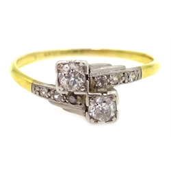 18ct gold diamond cross-over ring, diamond shoulders stamped 18ct plat