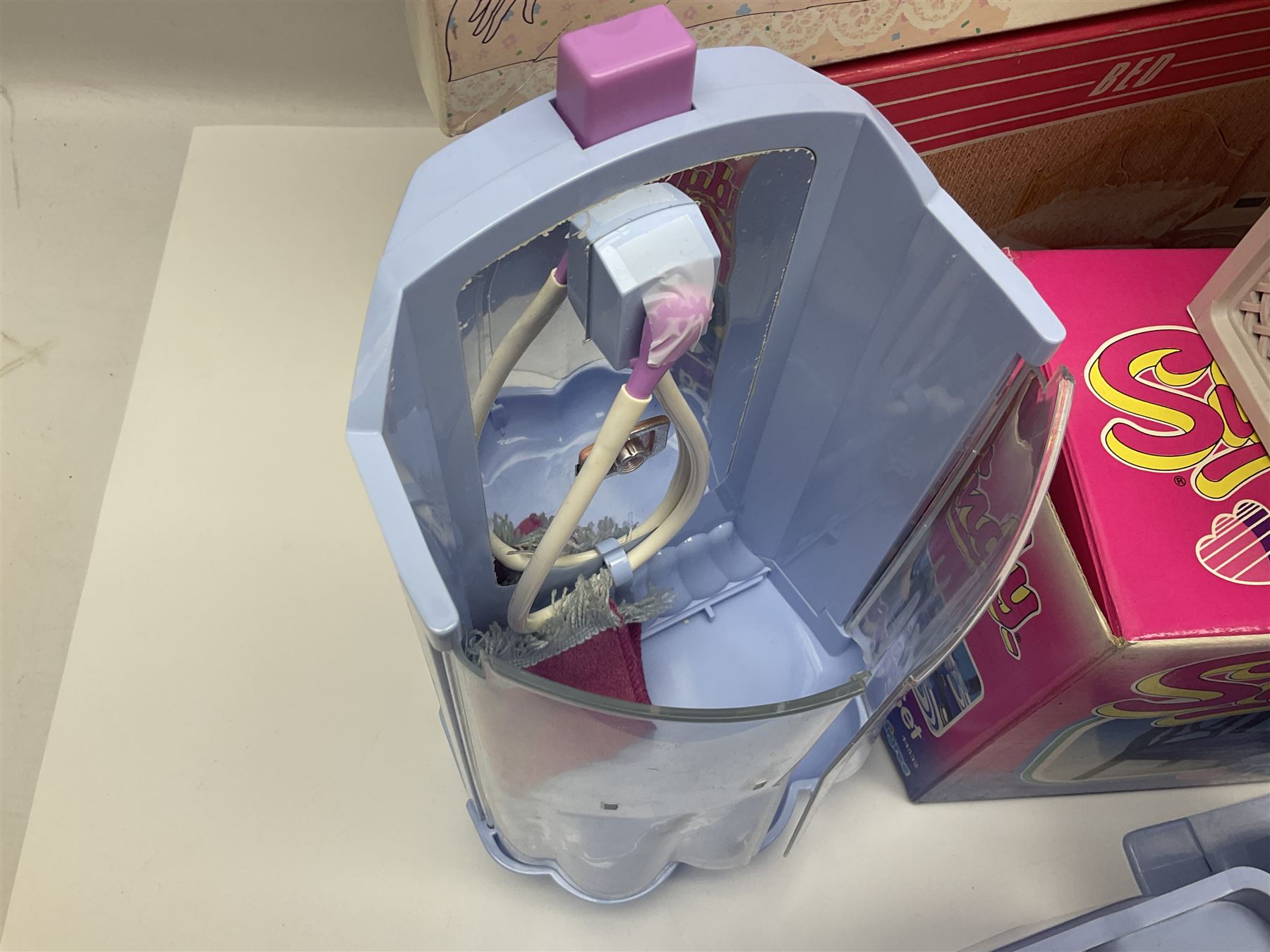 Sindy - furniture and accessories comprising dining suite with separate dresser; two beds; Garden Set; Music Centre; all  boxed; three-piece bedroom suite; settee; Hostess Trolley; two coffee tables; and four-piece bathroom suite including shower cubicle