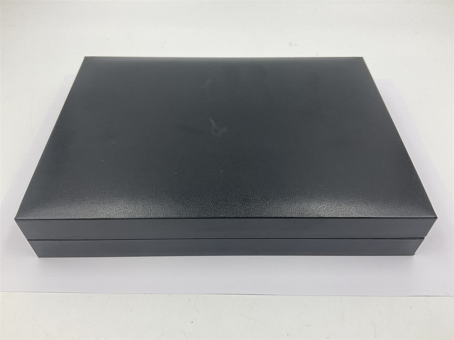 Queen Elizabeth II Bailiwick of Guernsey 2019 'The Titanium Moonlanding' fifty pence three coin set, comprising 'Green', 'Orange' and 'Blue' titanium coins, in capsules and case with certificate