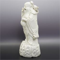 Chinese blanc de chine figure of Shou Lao, standing upon a cloud, H36cm 