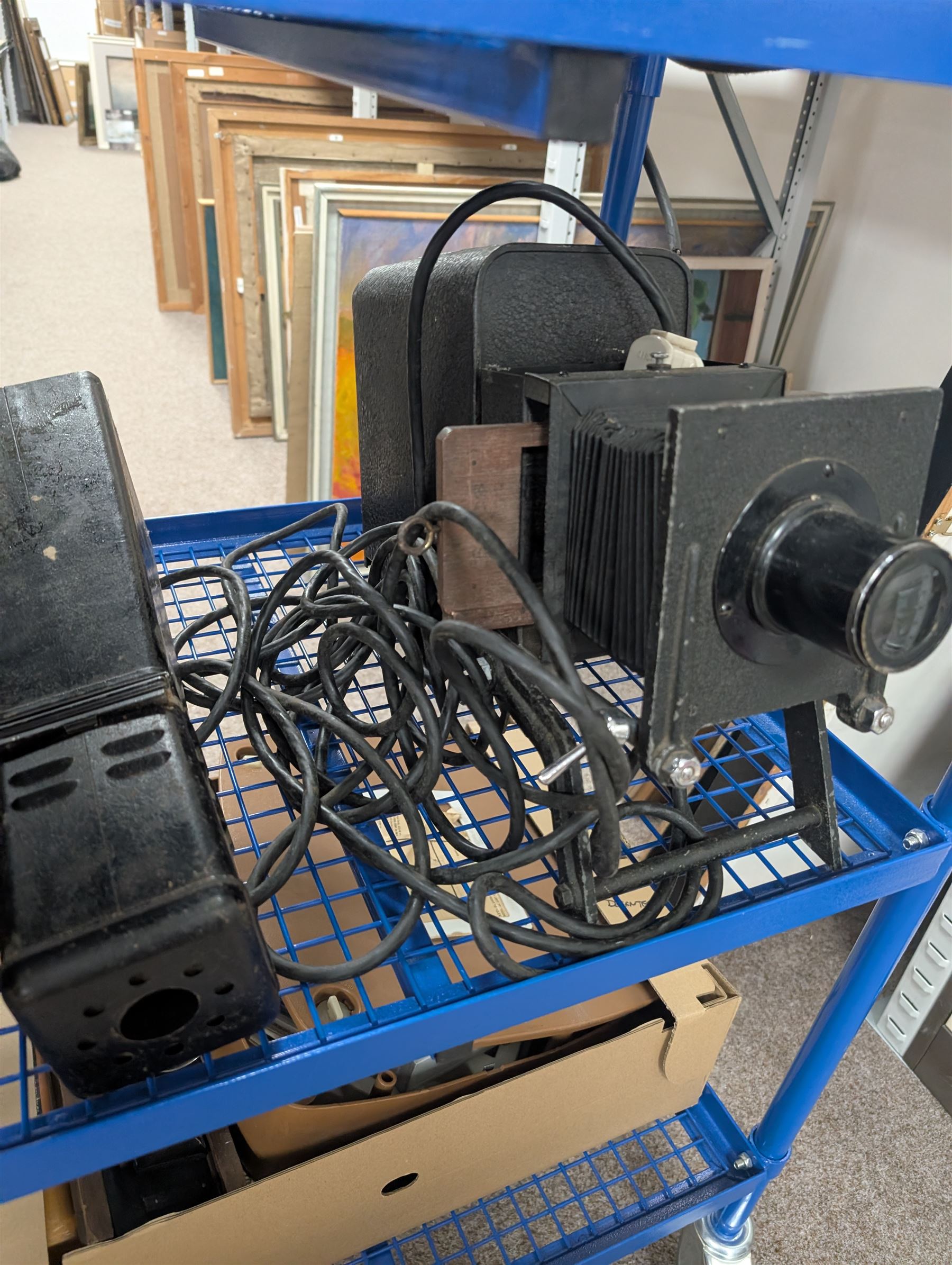 Collection of projectors, epidiascopes, magic lantern and similar, including Bell & Howell 621 projector, mahogany and brass magic lantern, Helper 6S projector, Leitz epidiascope, Zeiss epidiascope, Johnson Optiscope, etc