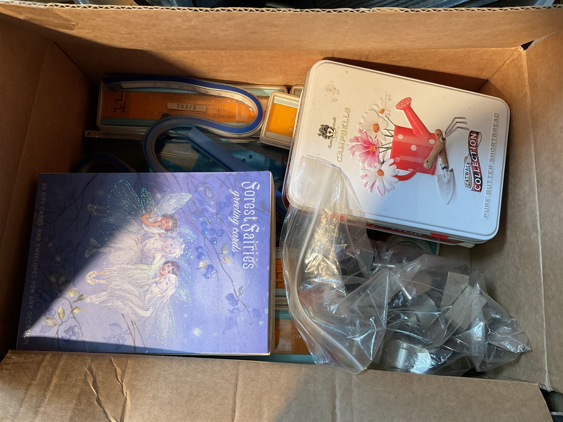 Two Singer sewing machines, model numbers 527 and 457, together with various Singer sewing machine parts, and a selection of sewing related accessories, to include threads, sewing needles, etc.