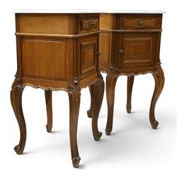 Pair of 20th century French honey oak and marble bedside cabinets, the square marble top with moulded edge, fitted with single drawer over panelled cupboard, shaped and moulded apron over scrolling acanthus leaf applied knees terminating to cabriole legs with scroll feet