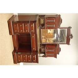  Quality late Victorian mahogany dressing table, two raised cupboards supporting bevelled mirror, enclosed by carved panelled doors, inverse moulded break front top above nine as lined drawers around a knee hole, locks stamped 'H' with arrow, W143cm, H183cm, D60cm   