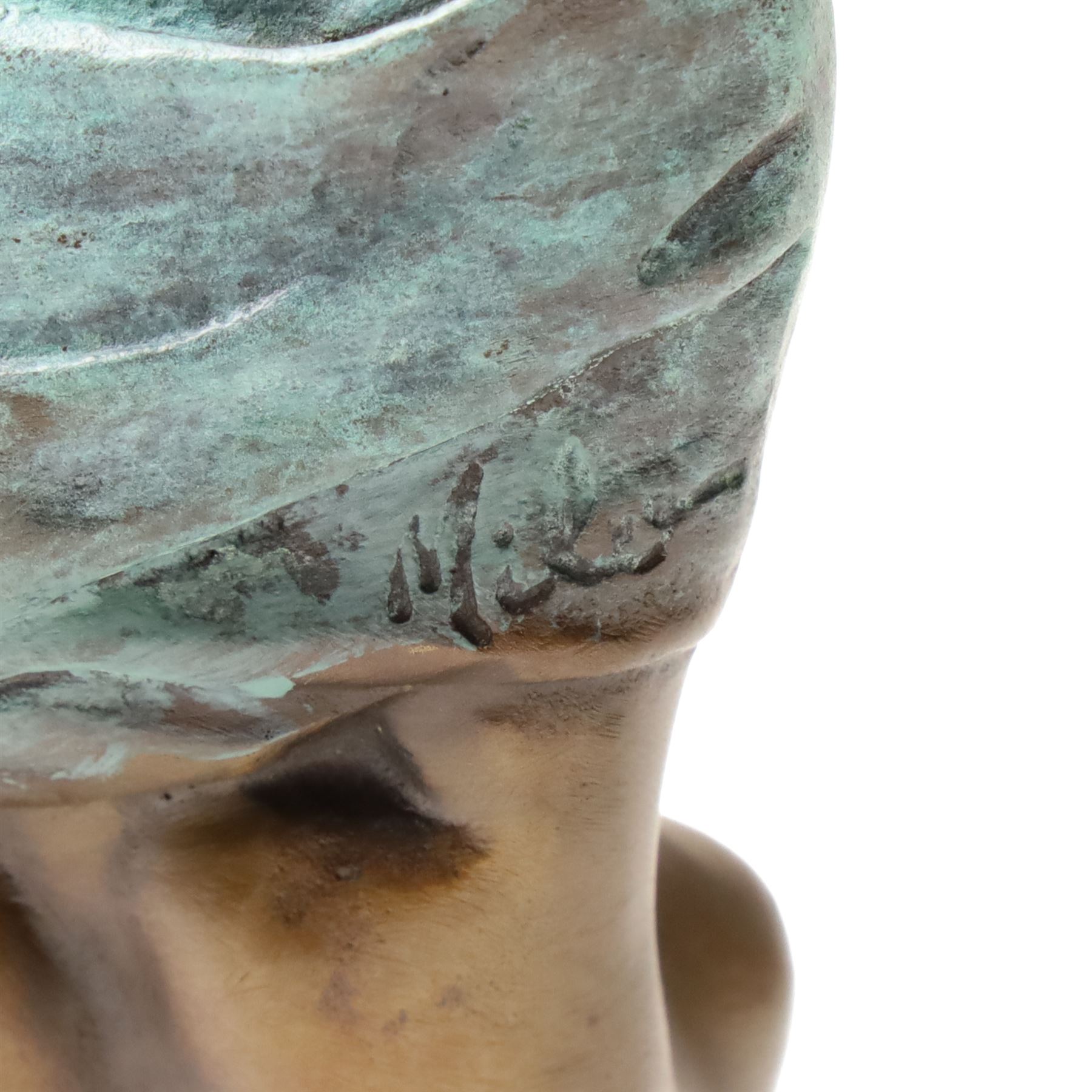 Bronze figure of a kneeling nude removing her shirt, signed 'Milo', H17cm
