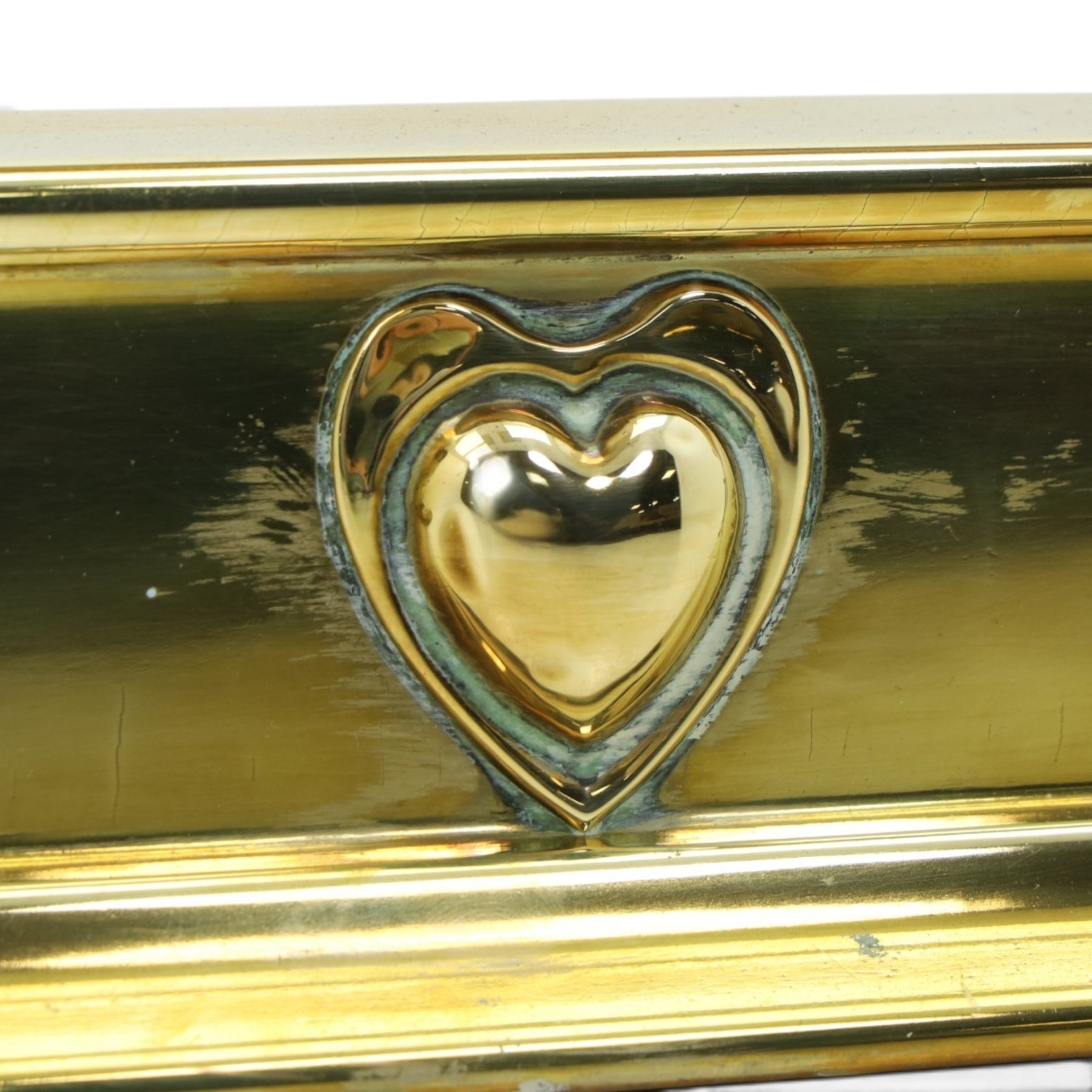 Two Edwardian brass fire curbs, comprising a decorative example with pierced vertical frieze, applied Tulips (H 21cm, W 126cm, D 32cm), together with a hammered moulded example with acanthus corners (H 12cm, W 138cm, D 37cm)