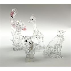 A group of four Swarovski Crystal figures, including a giraffe H14.5cm, a flamingo H16cm, a koala with baby H8.5cm and a big cat H9.5cm, all in original boxes  